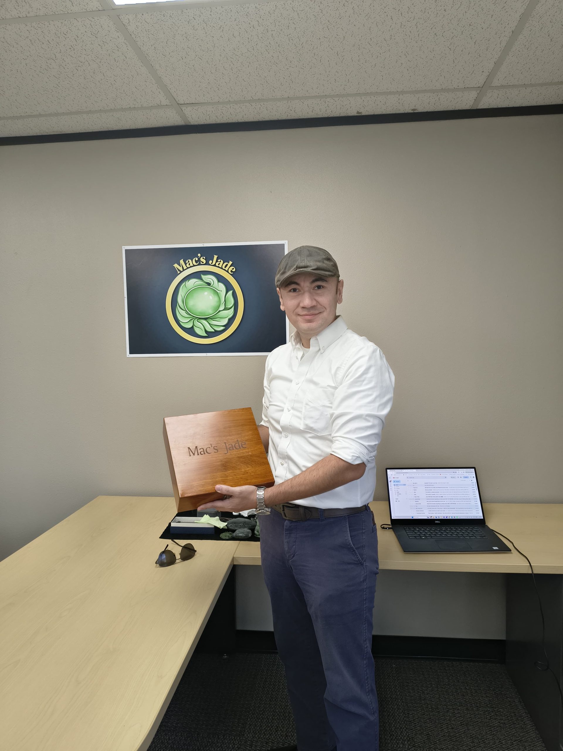 Mac Tayir holding a Mac's Jade presentation box